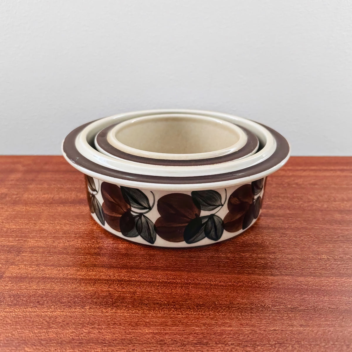 Set of Arabia Finland Ruija Serving Bowls featuring vintage Nordic ceramic design with brown floral pattern, showcasing classic Scandinavian craftsmanship by Raija Uosikkinen.