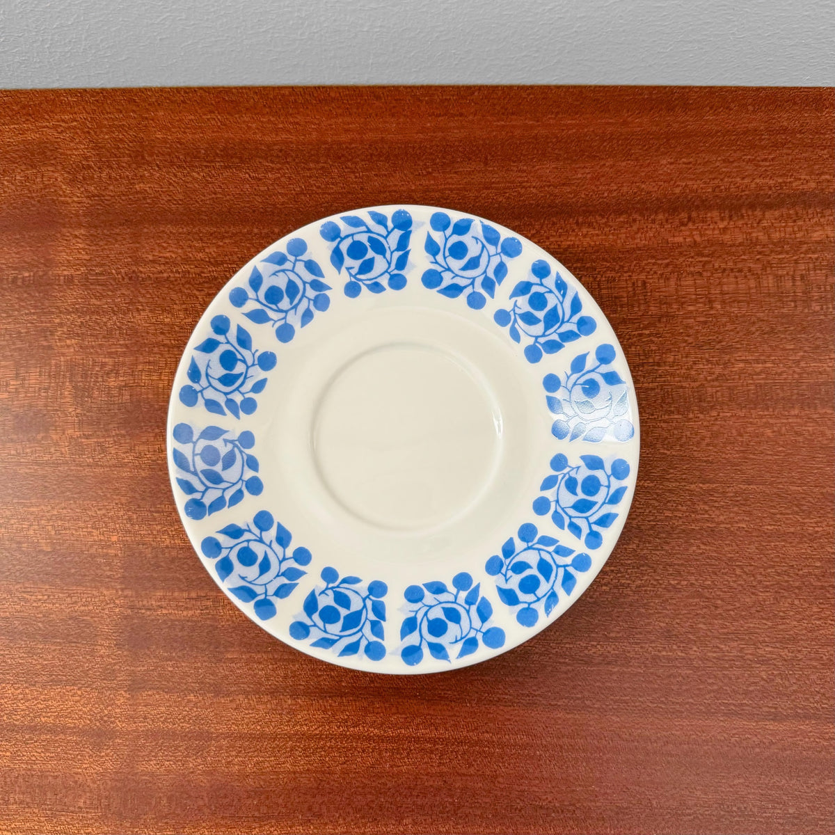 Gustavsberg Bladruta Coffee Cup Trio Set saucer featuring a vintage blue floral pattern on white ceramic, showcasing Nordic design by Stig Lindberg.