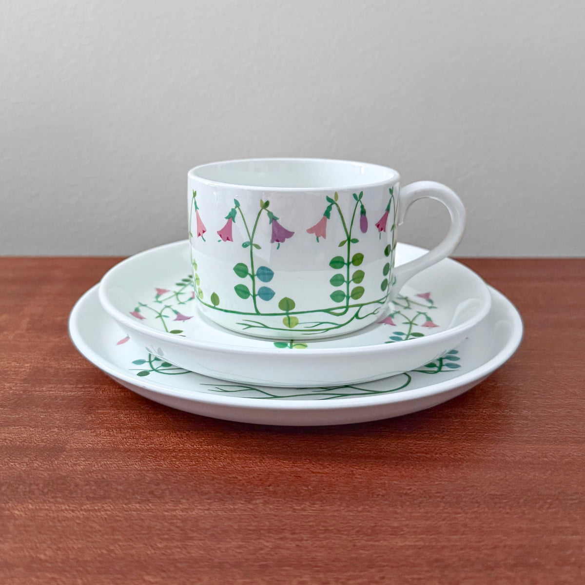 Gustavsberg Linnea Tea Cup Trio Set featuring a vintage cup, saucer, and cake plate with floral design by Stig Lindberg, showcasing classic Scandinavian ceramics and tableware.