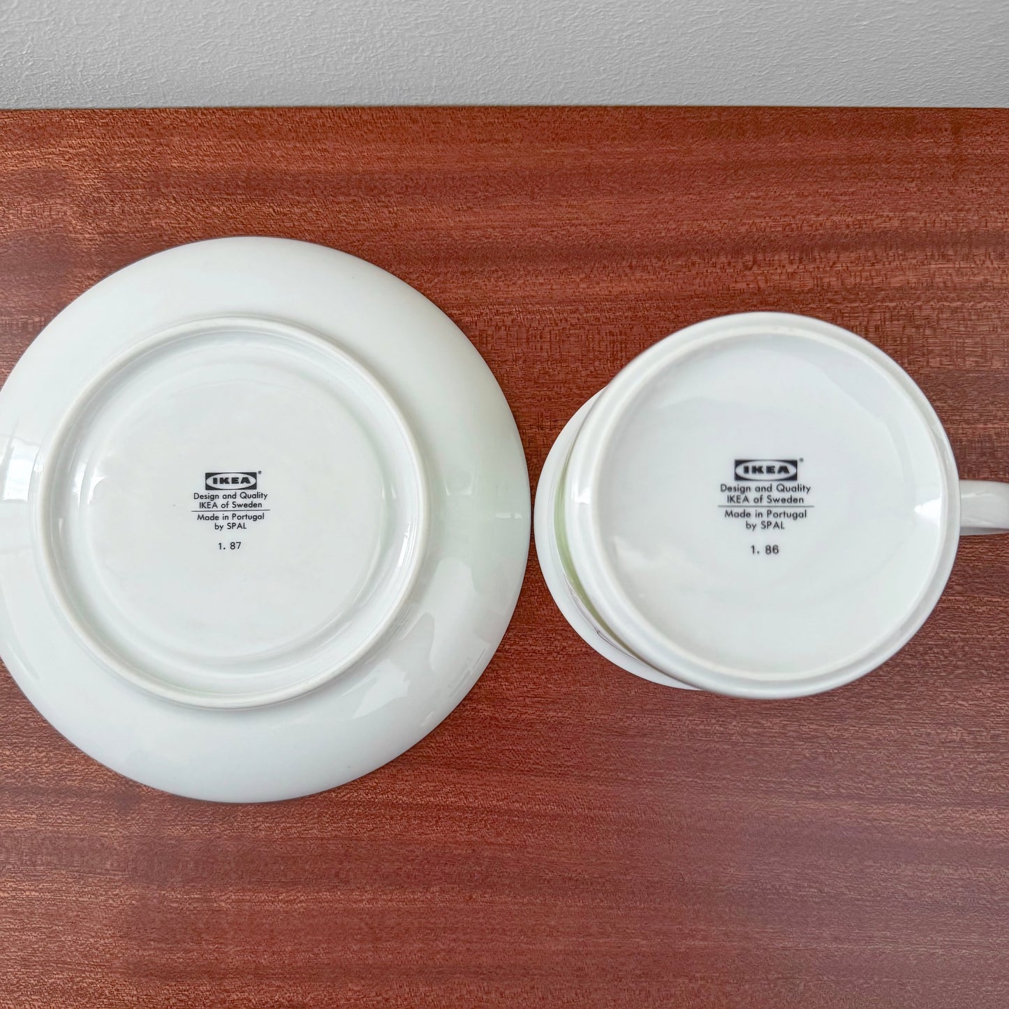 IKEA Näckros Large Tea Cup with Saucer showing the underside markings of the vintage ceramic set made in Sweden, resting on a wooden surface in a Nordic Wares Store setting.