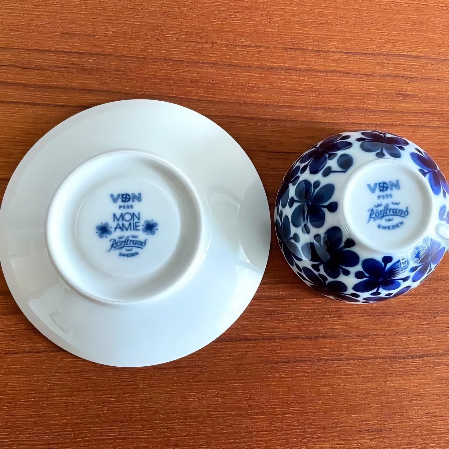 Vintage Rörstrand Mon Amie Coffee Cup with Saucer shown upside down, displaying the blue floral pattern and maker’s marks, highlighting authentic Nordic ceramics from the 1950s.