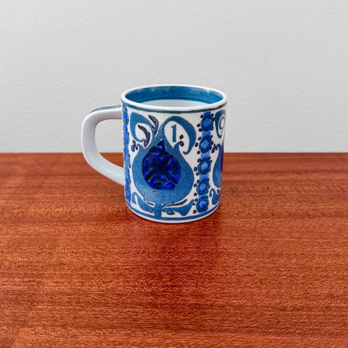 Royal Copenhagen Small Annual Mug 1969 featuring blue decorative motifs on white ceramic, showcasing vintage Nordic craftsmanship in drinkware from Denmark.