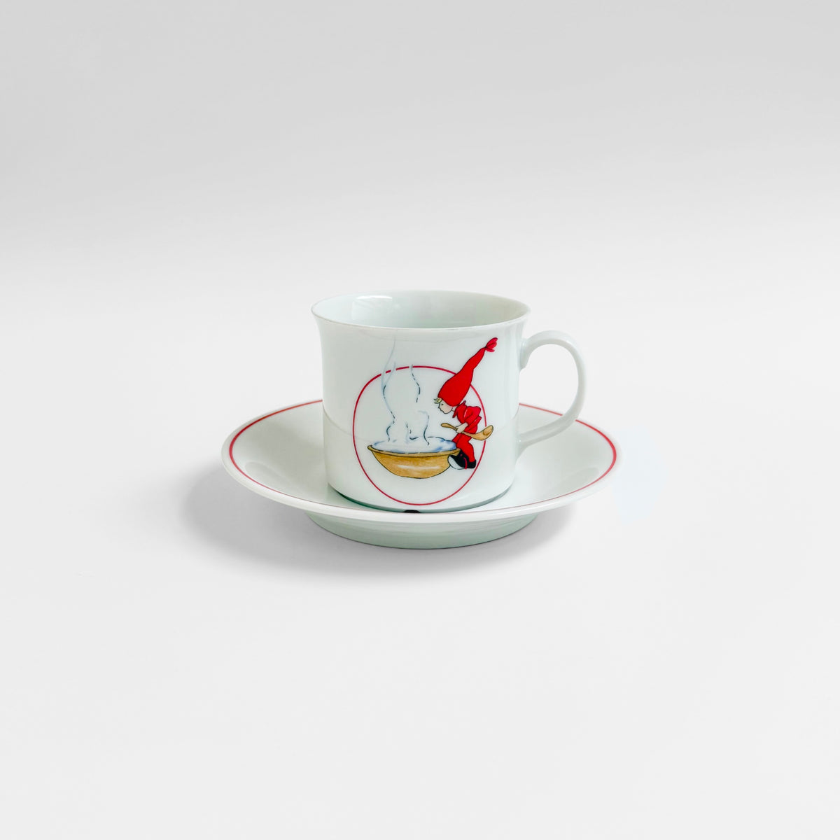 Aina Stenberg Rörstrand Tomtejul Coffee Cup with Saucer in white ceramic with red trim and festive Nordic illustration vintage 1970s drinkware set