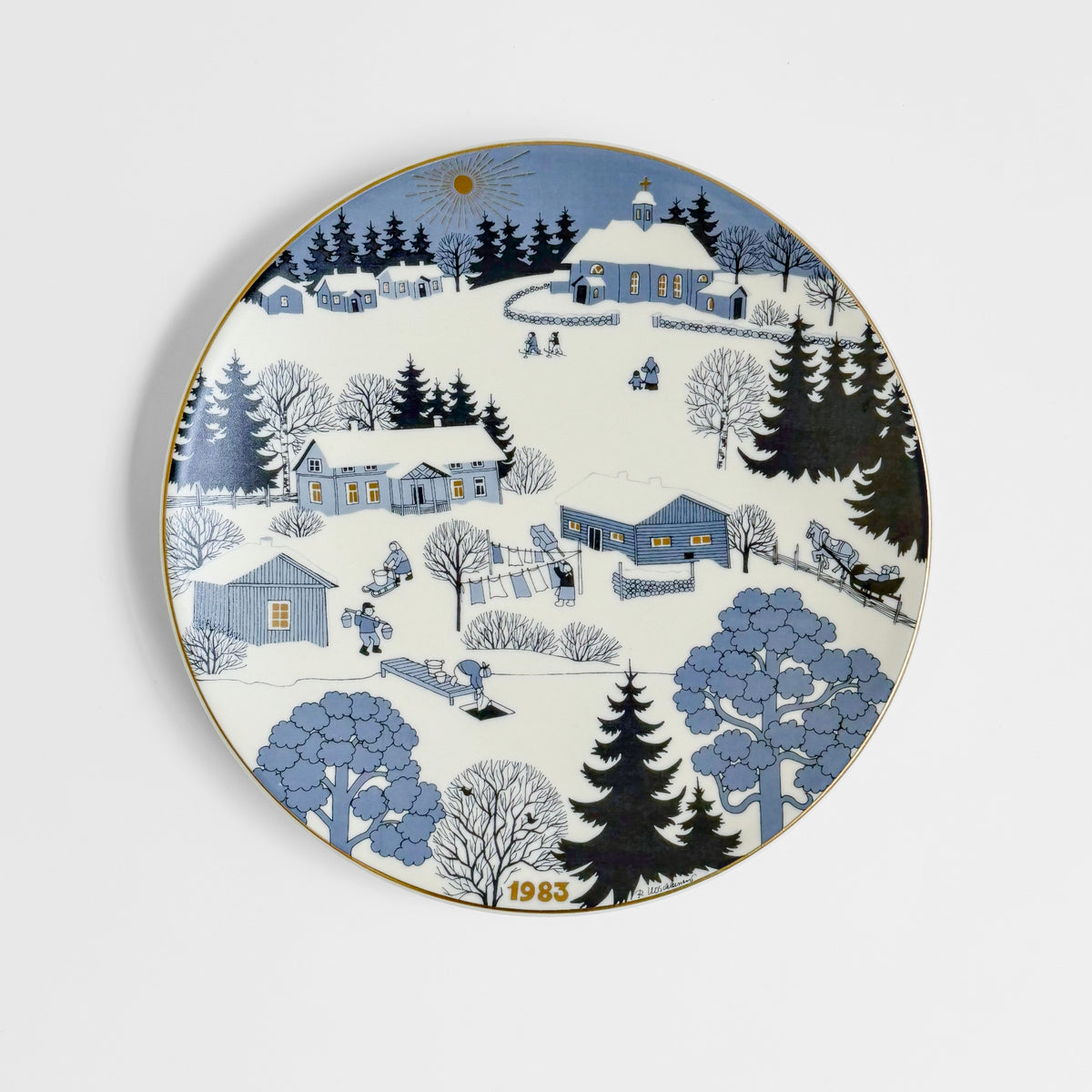 Arabia Finland Christmas Plates (1978-1989) vintage decorative plate with a snowy Nordic village scene and blue forest landscape dated 1983