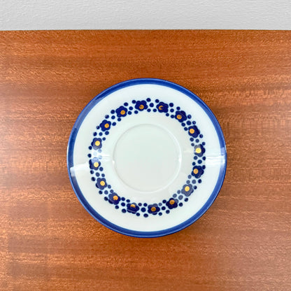 Arabia Finland Virva Espresso Cup with Saucer featuring a vintage 1970s blue floral pattern on white ceramic, displayed on a wooden surface, showcasing Nordic craftsmanship.