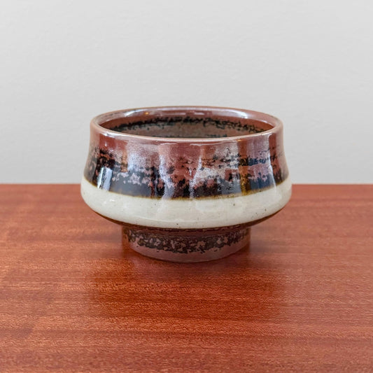 Carl-Harry Stålhane Designhuset Stoneware Decorative Bowl with brown, black, and white glazed ceramic, vintage Scandinavian craftsmanship, displayed on a wooden surface in a minimalist setting.