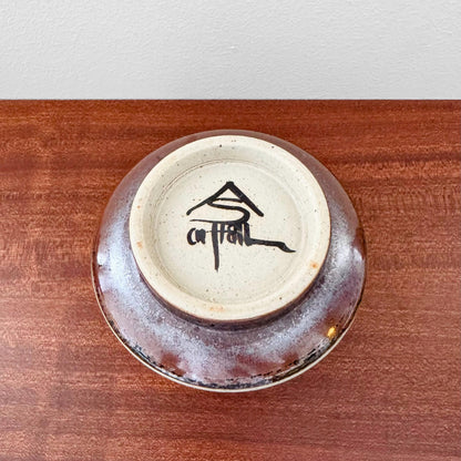 Carl-Harry Stålhane Designhuset Stoneware Decorative Bowl showing the underside with brown, black, and white glaze and the artist's signature on ceramic, vintage Nordic craftsmanship.