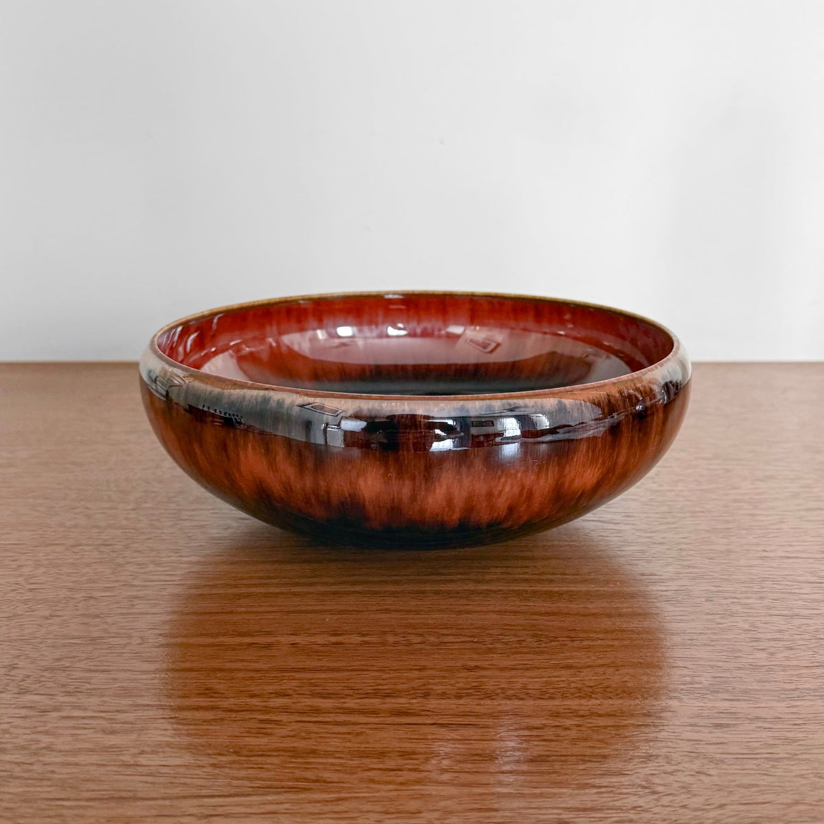 Carl-Harry Stålhane Rörstrand SAY Stoneware Decorative Bowl in brown and black glaze, showcasing vintage Scandinavian ceramic design and craftsmanship on a wooden surface.