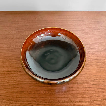 Carl-Harry Stålhane Rörstrand SAY Stoneware Decorative Bowl featuring a glossy brown and black glaze, vintage Nordic ceramic piece from the 1950s–60s displayed on a wooden surface.