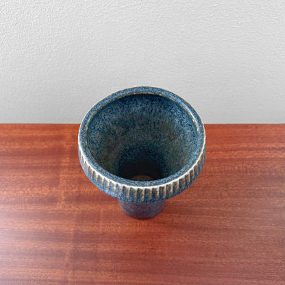 Carl-Harry Stålhane Rörstrand SGZ Stoneware Vase in blue glazed ceramic with a textured fluted rim shown from above on a wooden surface