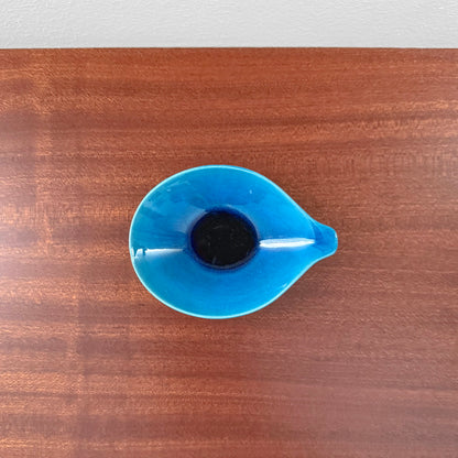 Carl-Harry Stålhane Rörstrand SP Small Blue Stoneware Decorative Dish in vivid blue glaze with a dark central well on a wooden tabletop