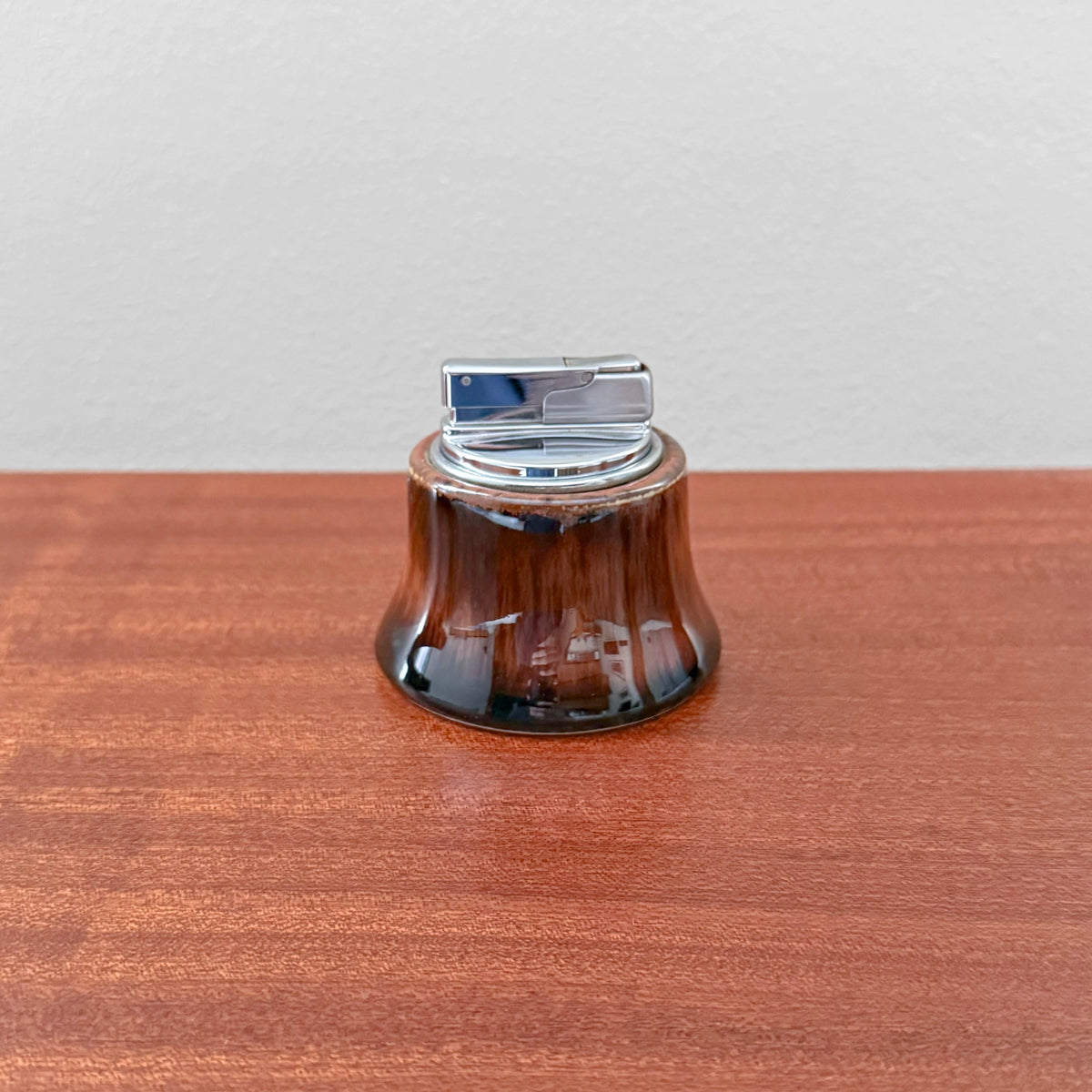 Carl-Harry Stålhane Rörstrand T-1 Brown-Black Table Lighter with glossy brown black ceramic glaze and silver metal lighter mechanism