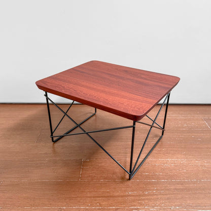 Eames Eucalyptus LTR Table featuring a solid eucalyptus wood top with natural knots and a black powder-coated wire base, showcasing a blend of Nordic design and craftsmanship.