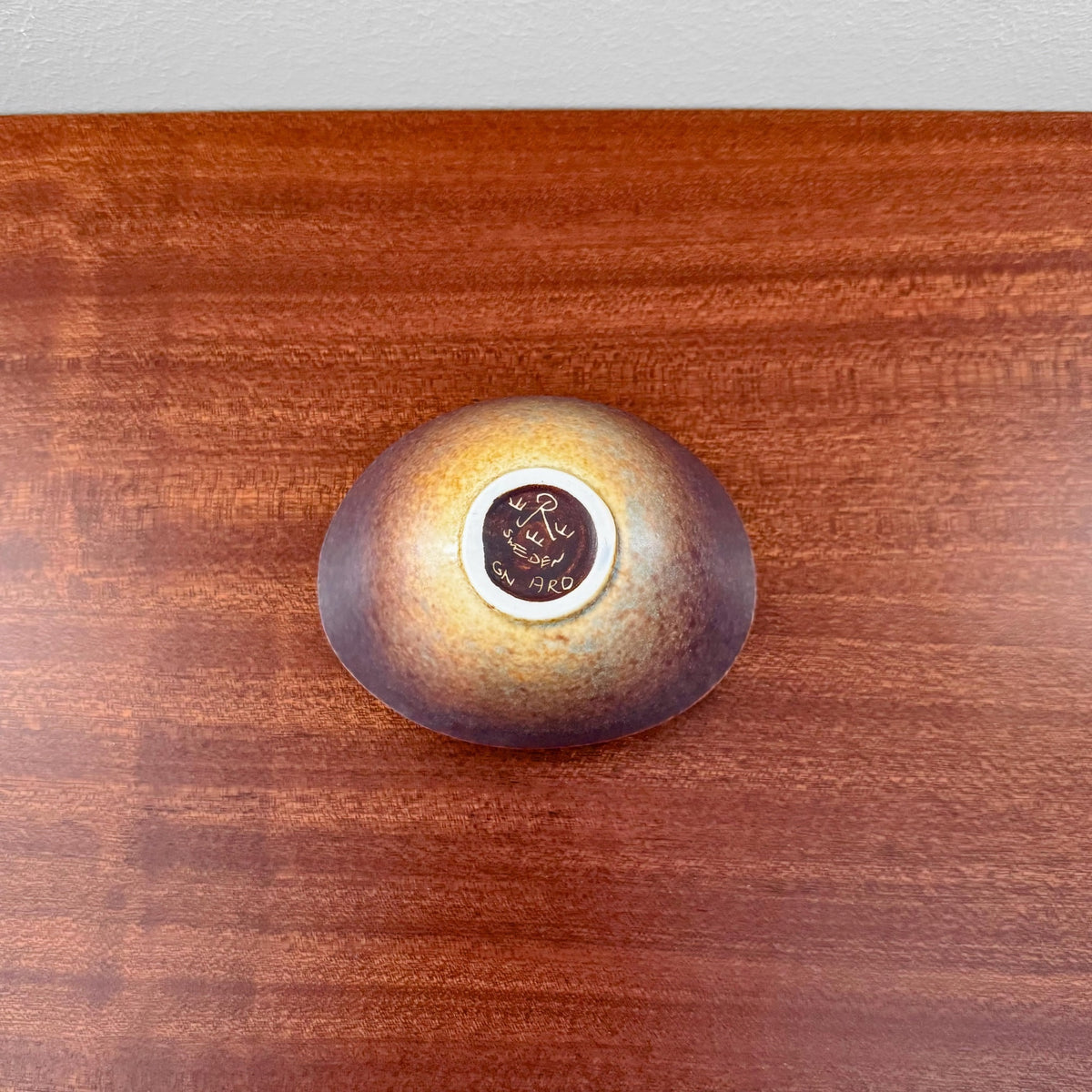 Gunnar Nylund Rörstrand ARO Small Stoneware Decorative Bowl with blue and brown glaze, vintage 1950s-60s Nordic ceramic piece displayed on a wooden surface.