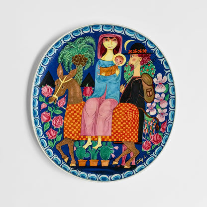 Gustavsberg Christmas Art Plates (1981-1982), decorative ceramic plate by Stig Lindberg featuring a colorful Christmas scene with a mother and child, deer, and flowers