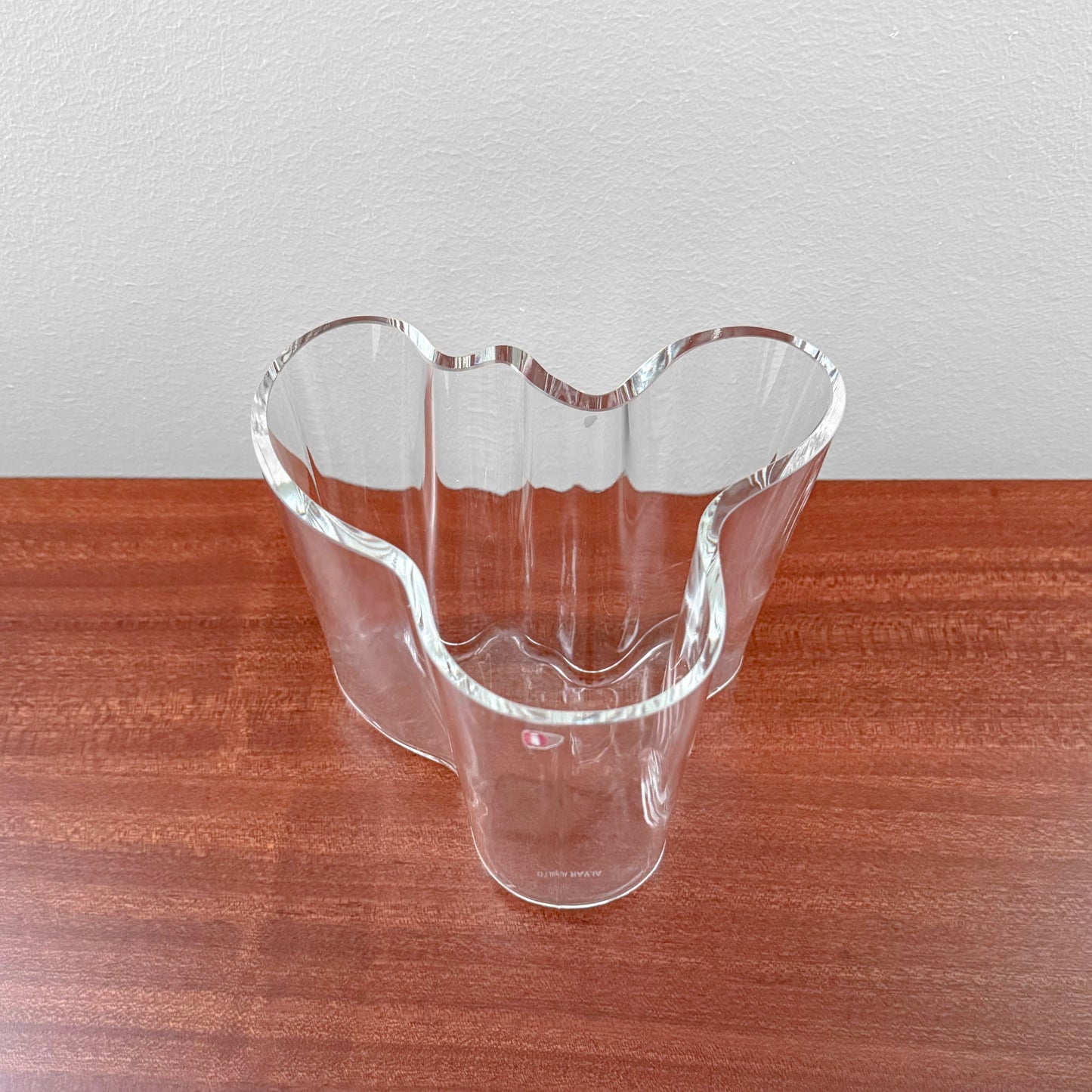 Iittala Aalto Savoy Clear Glass Vase (120 mm) with smooth, flowing organic shape, made of clear glass, showcasing Nordic design and craftsmanship by Alvar Aalto.