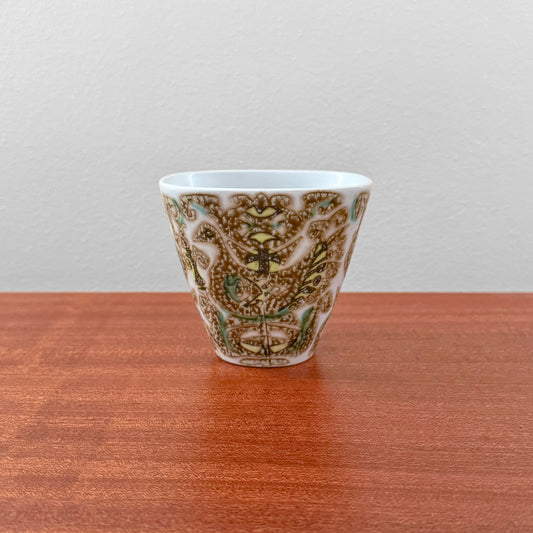 Nils Thorsson Royal Copenhagen Baca Small Vase (713/3216), ceramic vase with stylised bird motif in brown and green on a wooden surface.