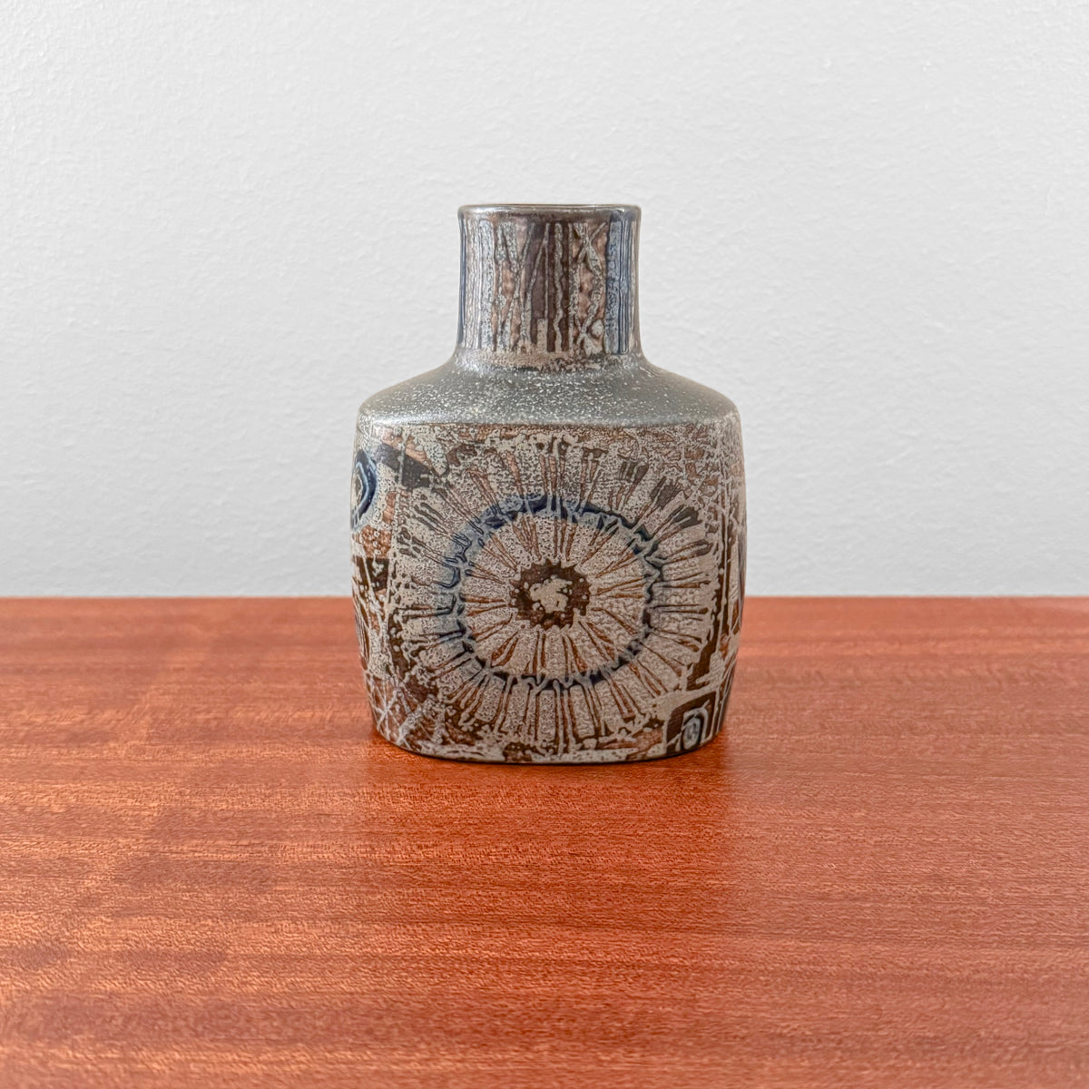 Nils Thorsson Royal Copenhagen Baca Small Vase (870/3207) in ceramic with stylised floral motif and textured brown and blue glaze. Danish vintage home decor.