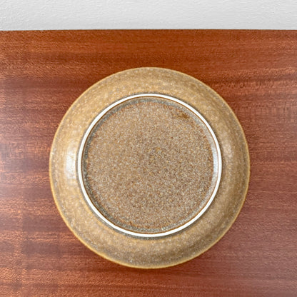 Quistgaard Relief Coffee Cup Trio Set vintage ceramic cake plate with textured brown glaze on wooden surface, showcasing classic Scandinavian drinkware craftsmanship.