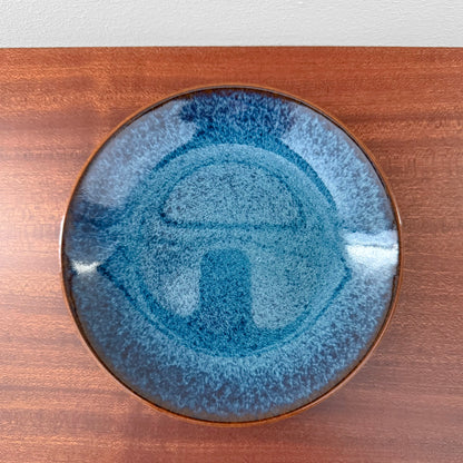 Rörstrand Litorina Blue Tea Cup Trio Set blue glazed cake plate with textured Nordic design and brown rim shown on a wooden surface