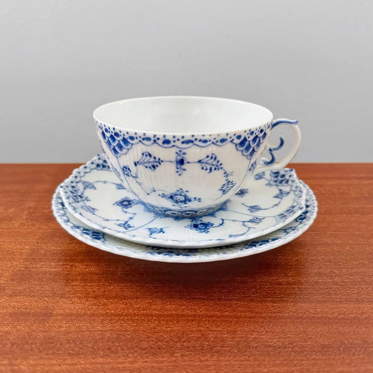 Royal Copenhagen Blue Fluted Full Lace Large Tea Cup Trio Set featuring vintage Danish ceramic craftsmanship with intricate blue floral and lace patterns on cup, saucer, and plate.