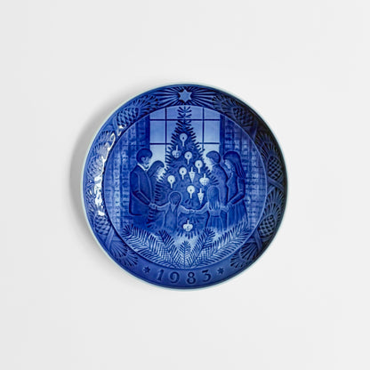 Royal Copenhagen Christmas Plates blue decorative dish with a festive Christmas tree scene and 1983 date, crafted in classic Nordic ceramic style