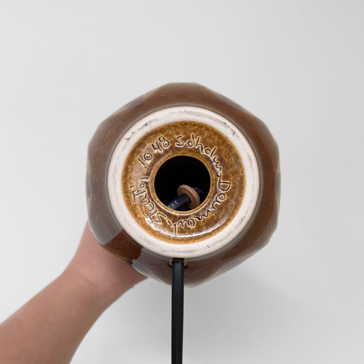 Søholm 1048 Black-Brown Stoneware Table Lamp underside showing Søholm Denmark Stentøj 1048 mark, ceramic base, socket, and black cord