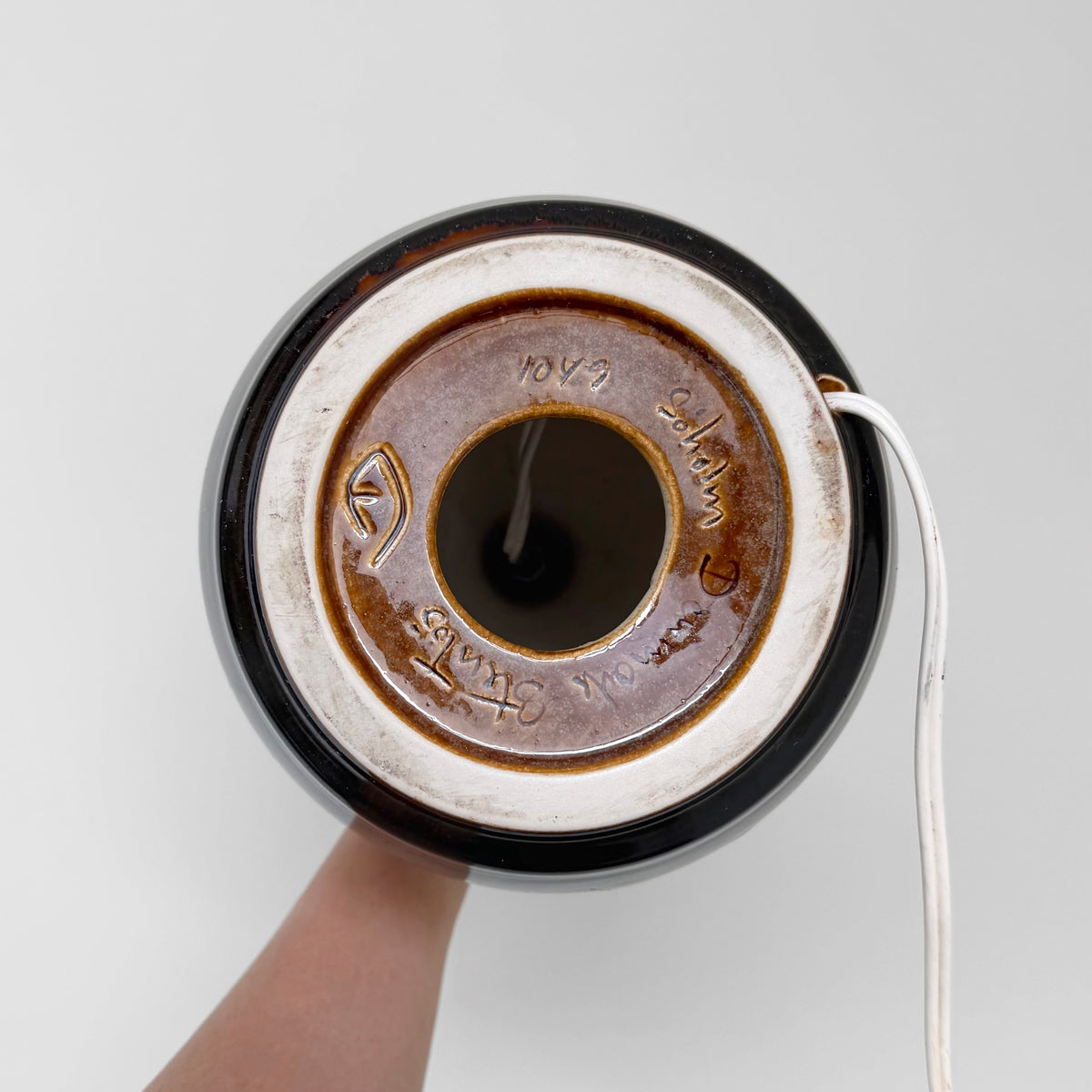 Søholm 1049 Brown-Black Stoneware Table Lamp underside showing ceramic base markings and white power cord