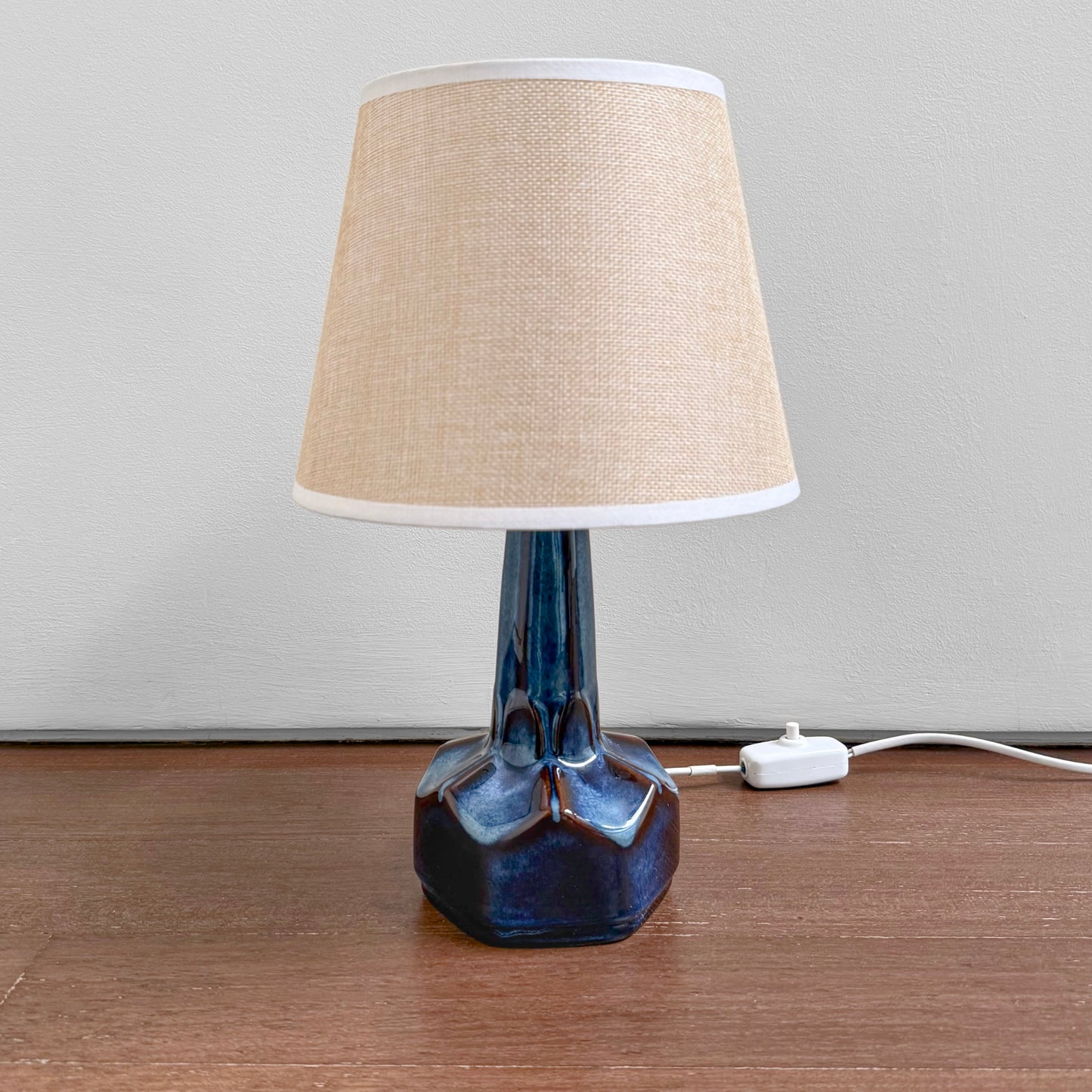 Søholm 1084 Blue Stoneware Table Lamp with a ceramic blue-glazed base and a beige fabric shade, showcasing vintage Nordic craftsmanship and mid-century Scandinavian design.