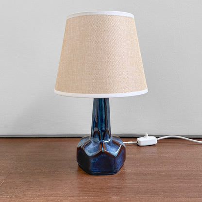 Søholm 1084 Blue Stoneware Table Lamp with a ceramic blue-glazed base and a beige fabric shade, showcasing vintage Nordic craftsmanship and mid-century Scandinavian design.