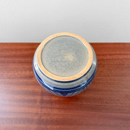 Søholm 1914 Blue Stoneware Vase viewed from below, showing blue ceramic glaze, impressed maker's stamp, and natural crazing on a wooden surface