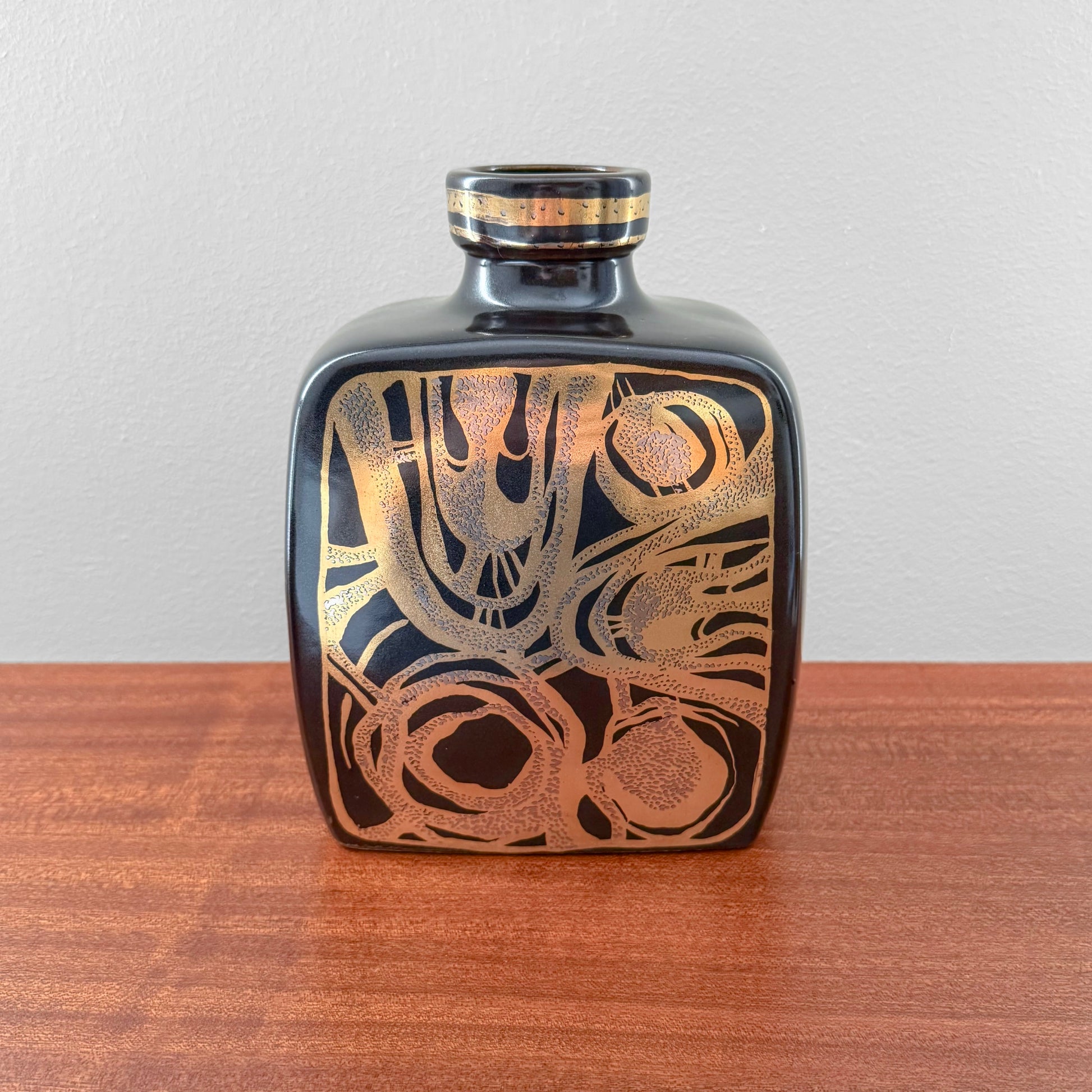 Vintage Søholm 2130 Black Stoneware Vase in black ceramic with abstract copper toned decoration, displayed on a wooden surface