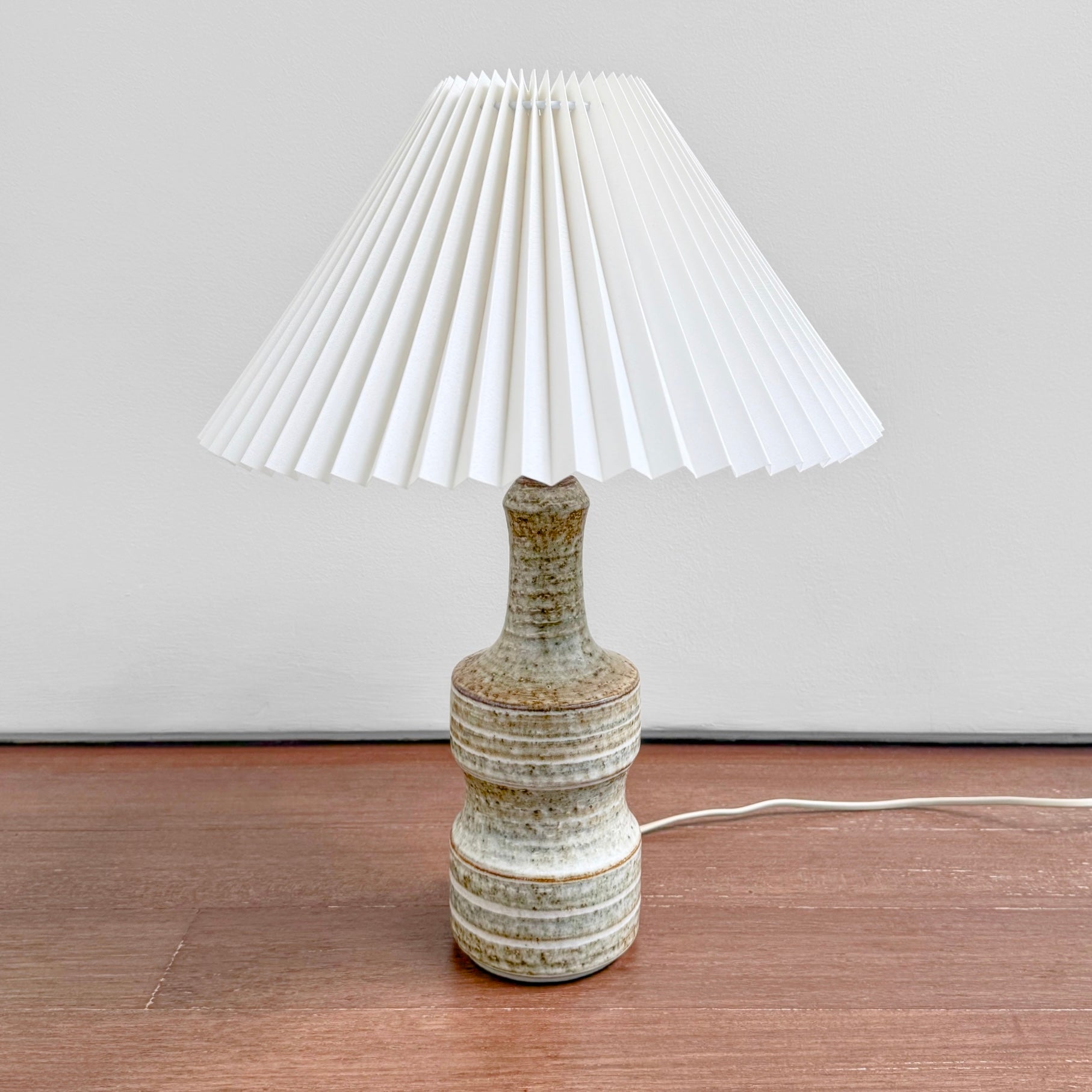Vintage Søholm 3059 Brown Stoneware Table Lamp in brown glazed ceramic with a white pleated shade, designed by Joseph Simon in Denmark in the 1960s.