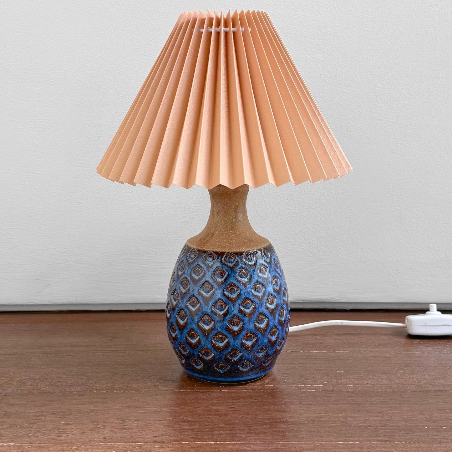 Søholm Blue Stoneware Table Lamp with a textured blue ceramic base and a new plastic pleated shade, inspired by vintage Nordic Scandinavian design.