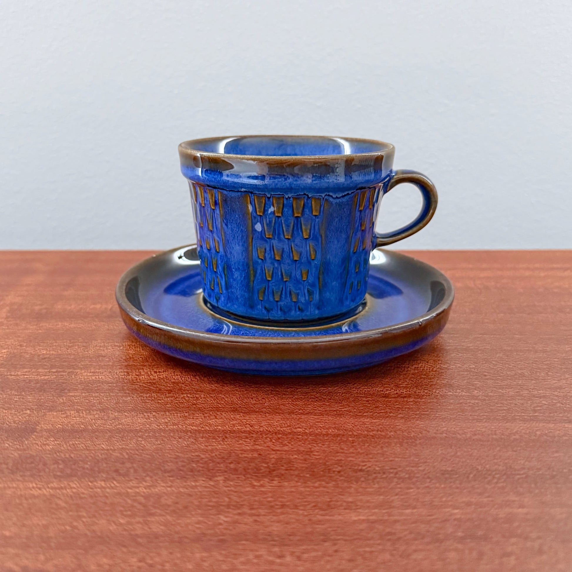 Søholm Granit Blue Tea Cup with Saucer featuring a vintage Nordic ceramic design in deep blue with brown accents, showcasing authentic Scandinavian craftsmanship.