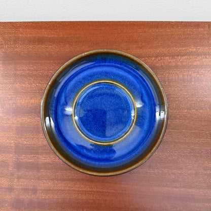 Søholm Granit Blue Tea Cup with Saucer showcasing a deep blue ceramic saucer with brown edges, highlighting vintage Scandinavian craftsmanship and Nordic design.