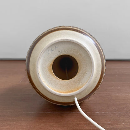 Bottom view of the Søholm 3070 Large Earthy Stoneware Table Lamp showing the ceramic base with earthy glaze and the white electrical cord emerging from the center.