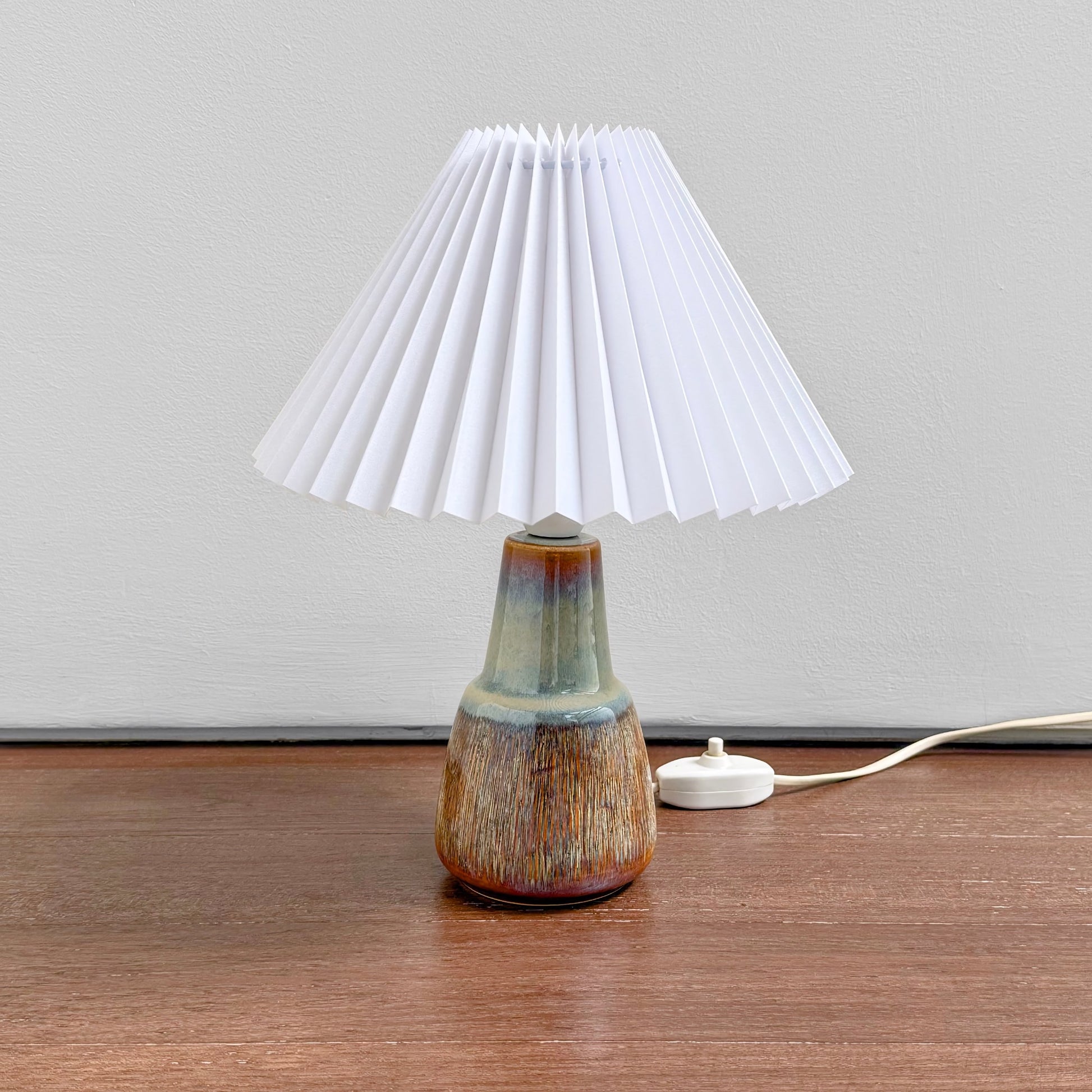 Søholm Manilla Blue-Green Stoneware Table Lamp with multitone ceramic base and new white plastic pleated shade, showcasing vintage Nordic design and craftsmanship.