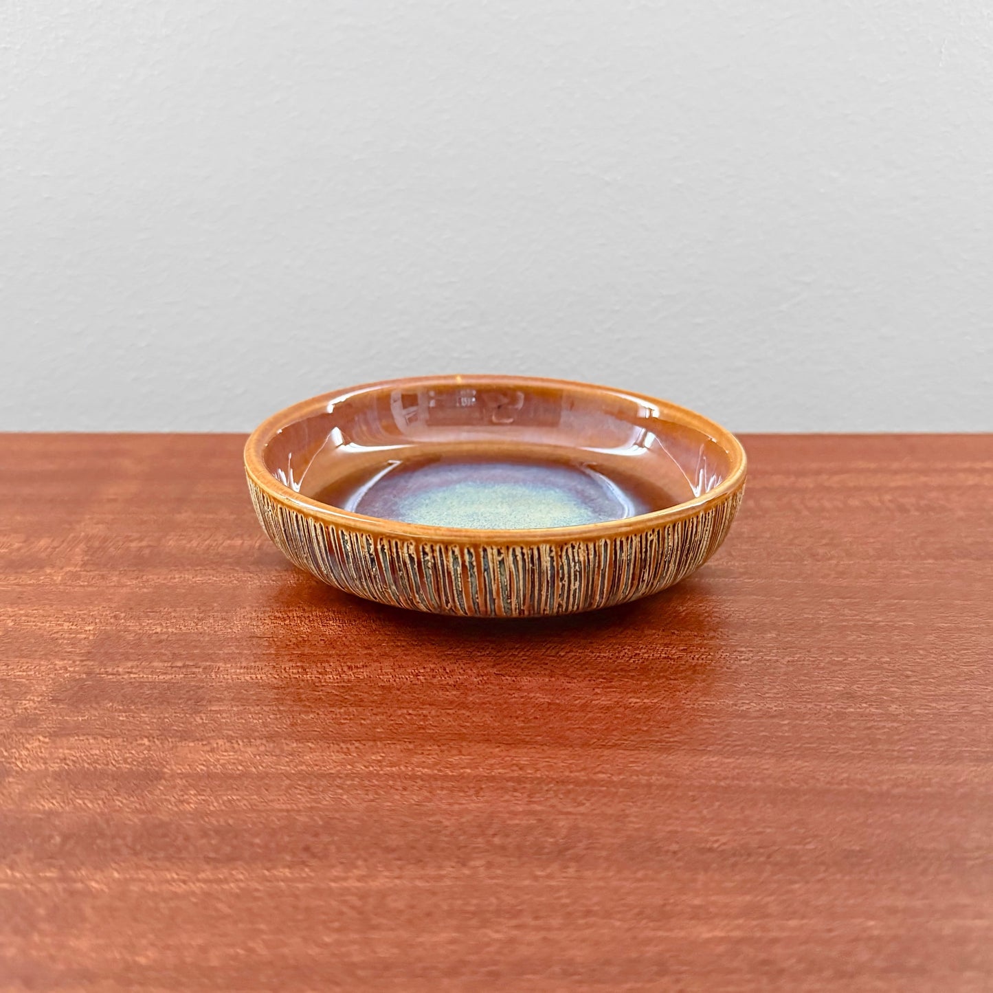 Søholm Manilla Small Stoneware Decorative Dish in warm brown glaze with textured sides and subtle blue-green center, showcasing vintage Nordic ceramics craftsmanship.