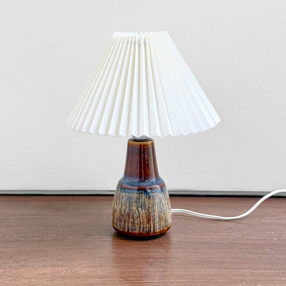 Søholm Manilla Brown Stoneware Table Lamp with multitone ceramic base and white pleated plastic shade, showcasing vintage Scandinavian design and Nordic craftsmanship.