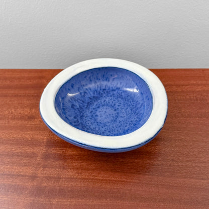 Swedish Blue Decorative Bowl with a deep blue interior and white rim displayed on a wooden surface as vintage Nordic home decor