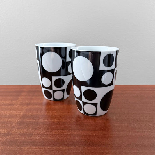 Verner Panton Geometri I Black and White Thermo Cups pair of vintage black and white geometric drinkware cups on a wooden table