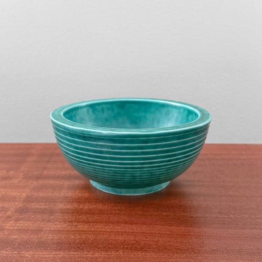 Wilhelm Kåge Gustavsberg Argenta Green Decorative Bowl in vintage turquoise green ceramic with ribbed bands displayed on a wooden table