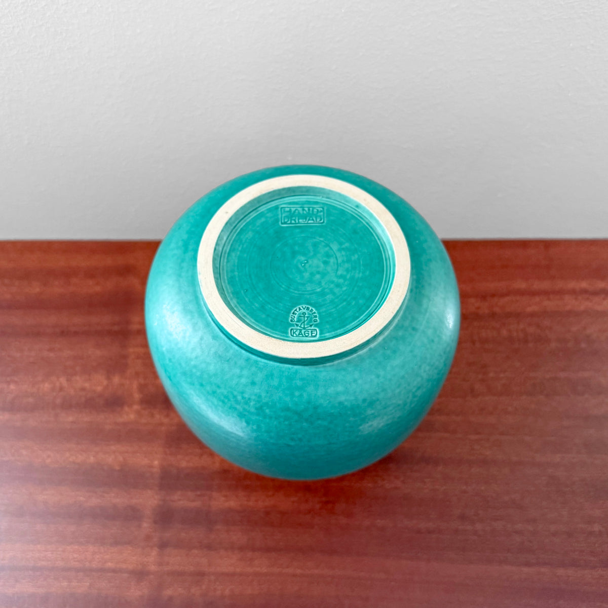Wilhelm Kåge Gustavsberg Argenta Green Vase underside showing impressed maker stamp on turquoise ceramic surface